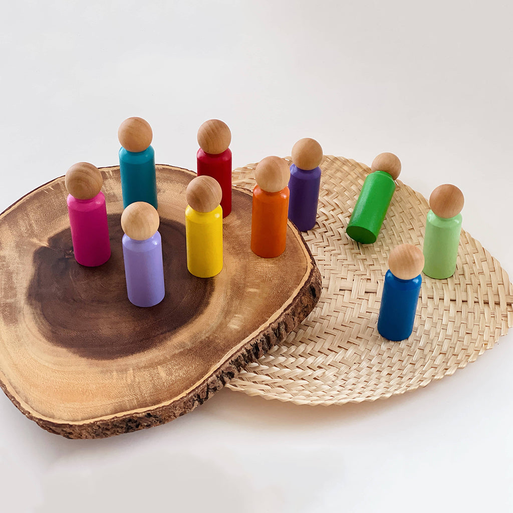 10 rainbow colored wooden peg doll people