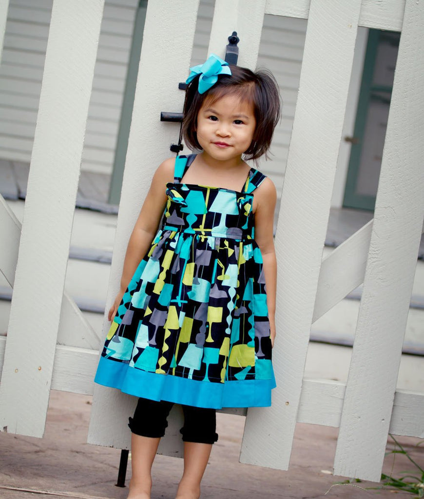 toddler wearing a blue dress for baby girl
