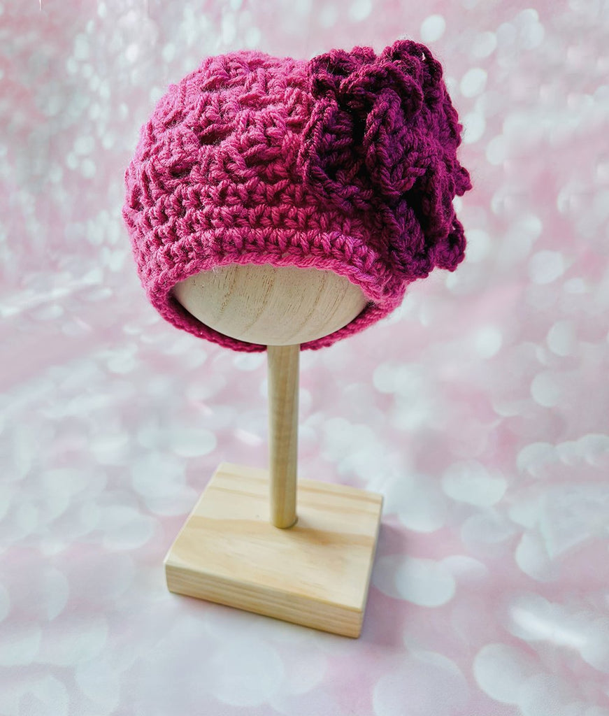 dark pink crochet baby girl beanie hat with purple flower accent