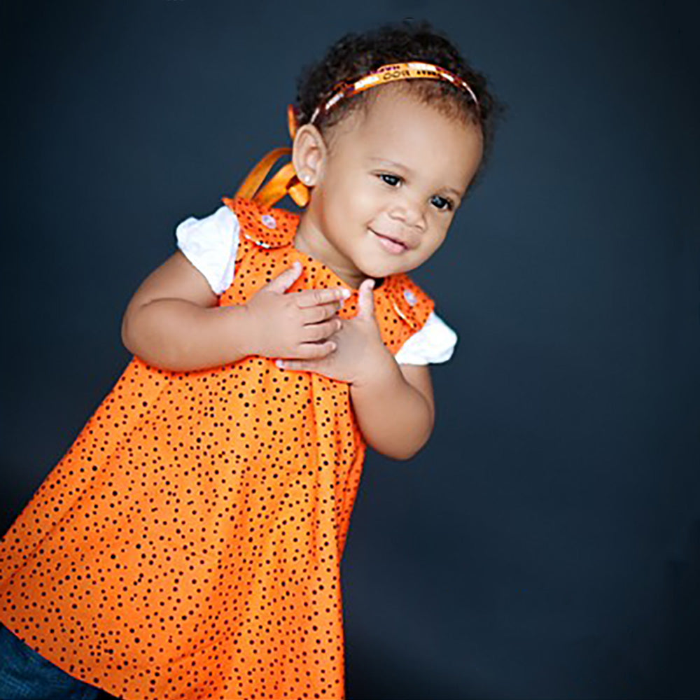 toddler girl wearing a Halloween dress