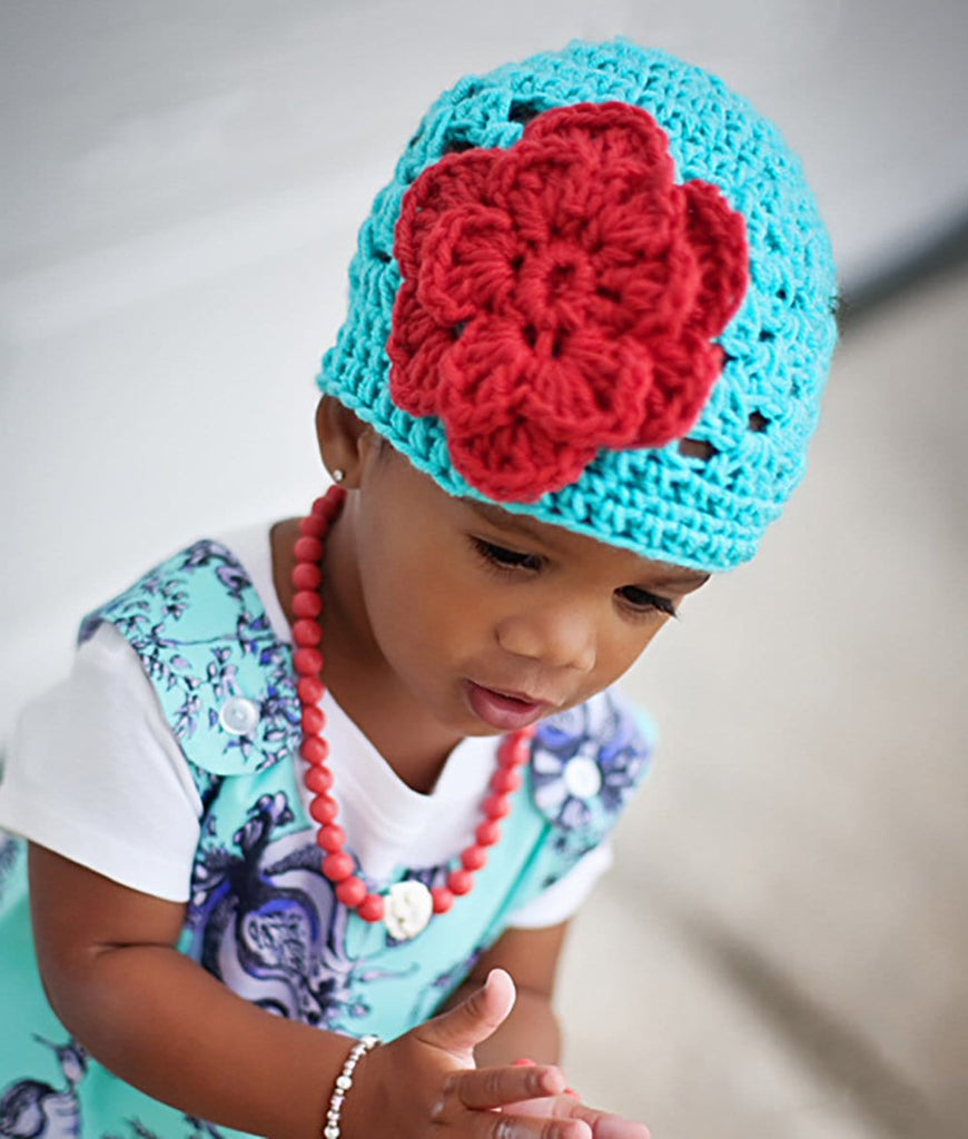 turquoise crochet baby girl beanie hat with burnt orange flower accent