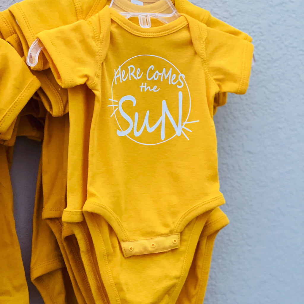 yellow 'Here Comes The Sun' infant onesie