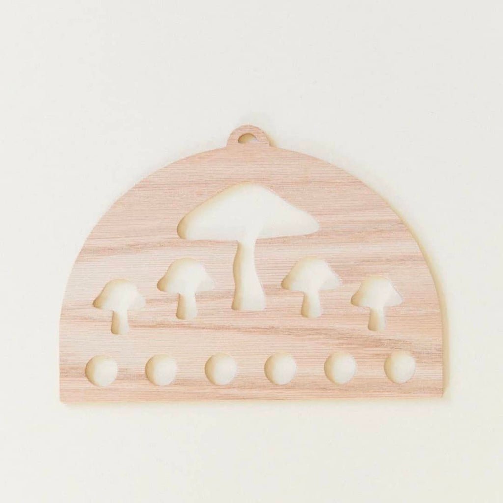 wooden Montessori playsilk display with mushroom print