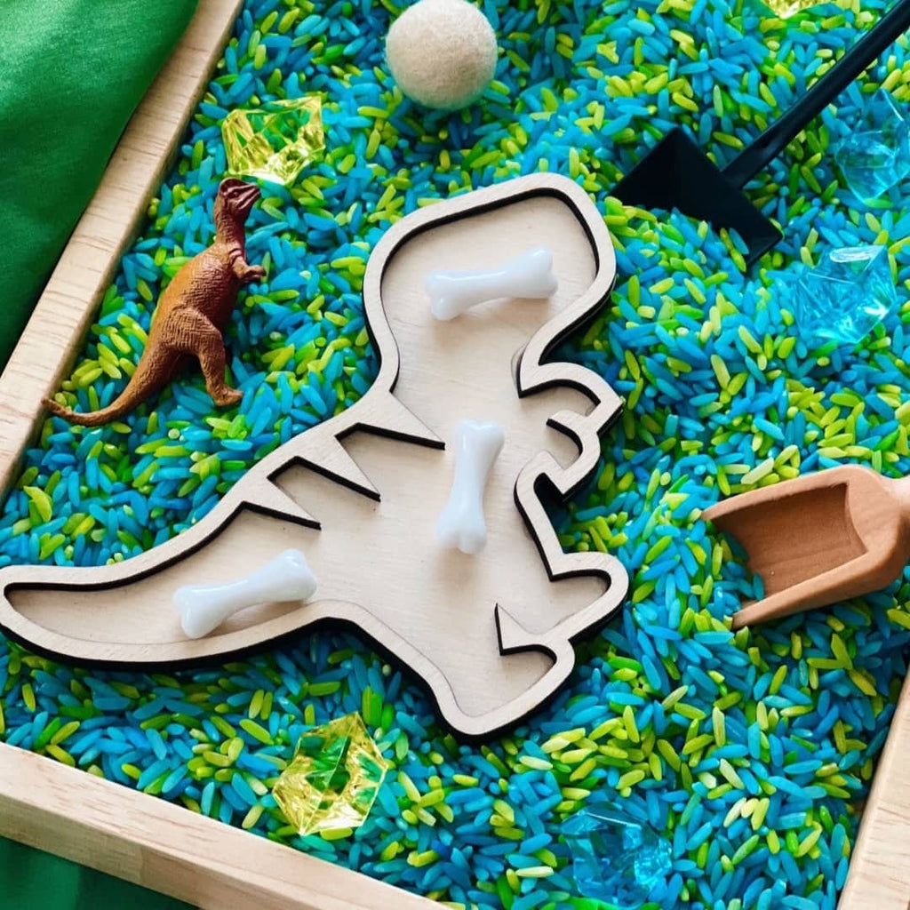 blue and green dinosaur rice sensory kit with wooden dino sorting tray