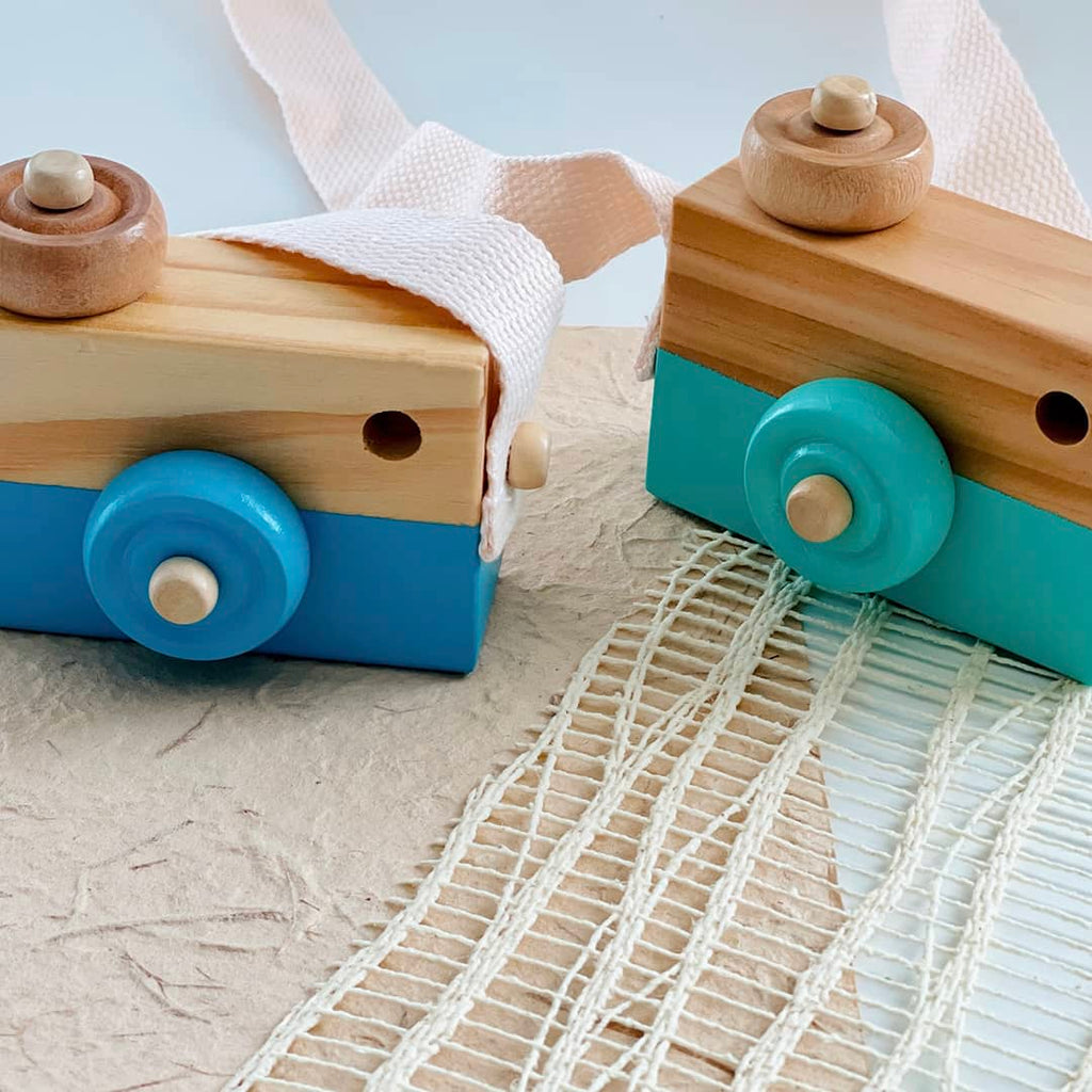 teal and light blue Montessori wooden camera toys for babies, toddlers, and kids