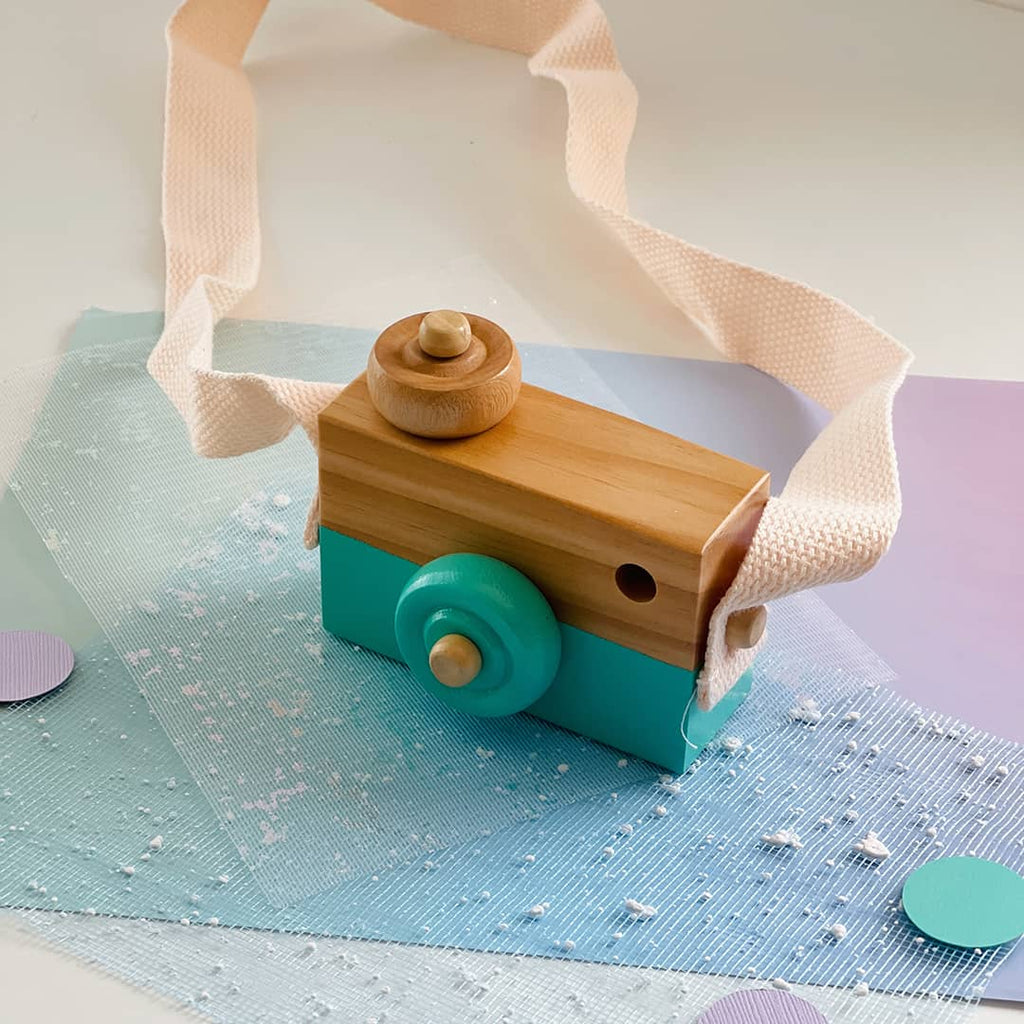 teal wooden kids camera toy for open ended play