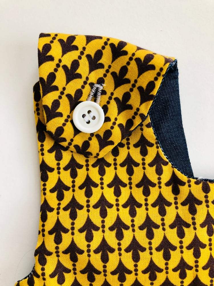 mustard yellow toddler dress strap close up