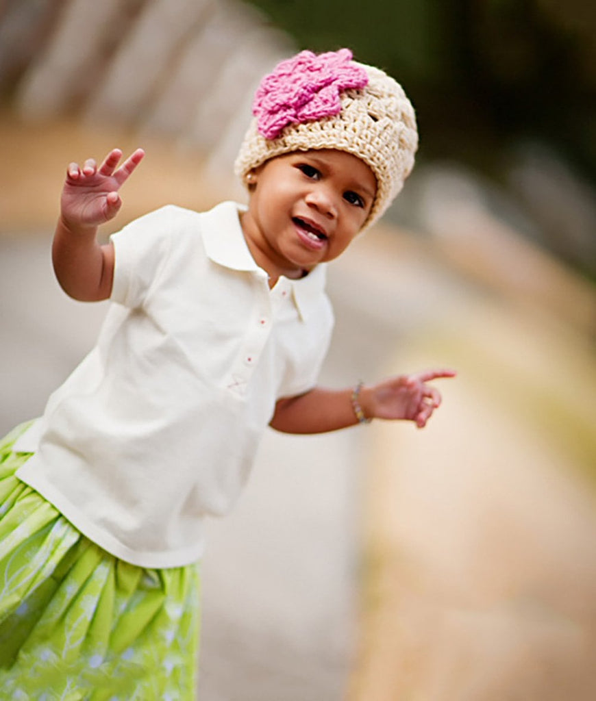 beige crochet baby girl beanie hat with pink flower accent