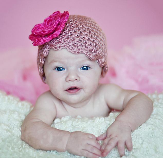rose colored crochet hat for baby girls with hot pink flower accent