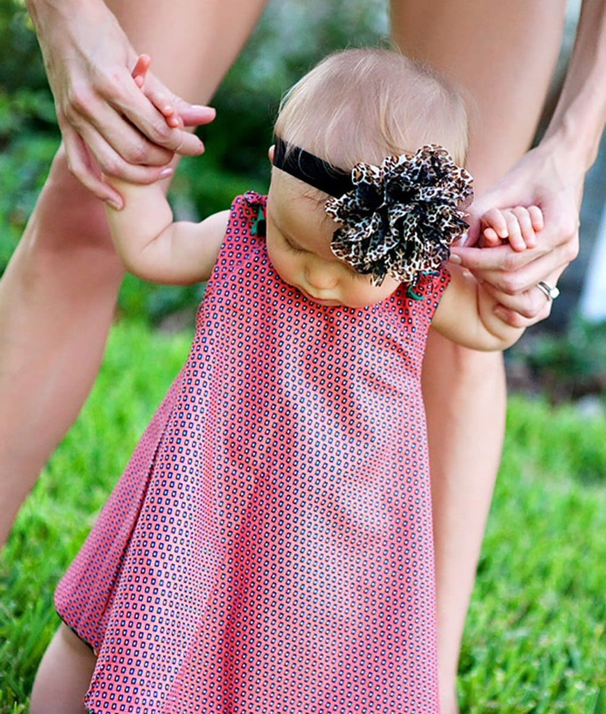 baby girl wearing a cute vintage dress