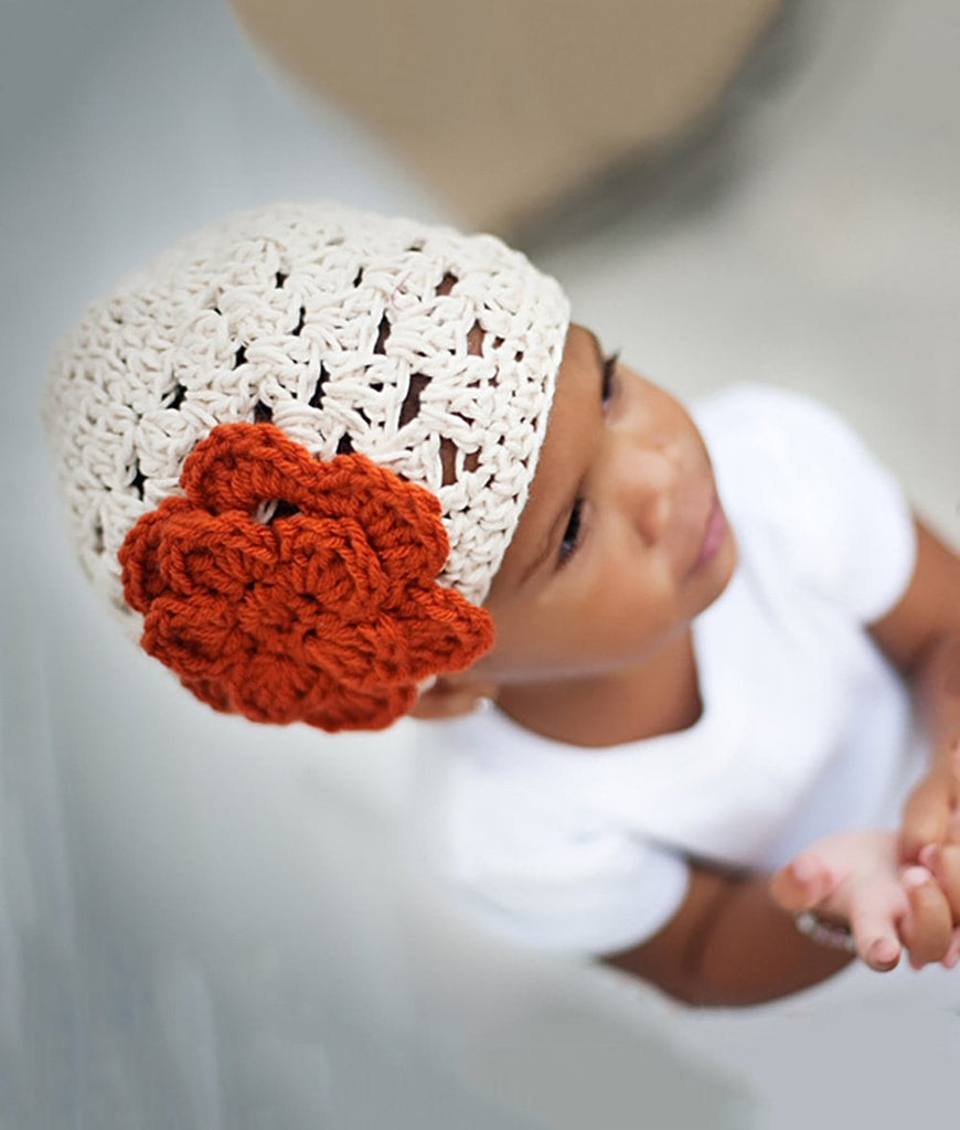 beige crochet baby girl beanie hat with burnt orange flower accent