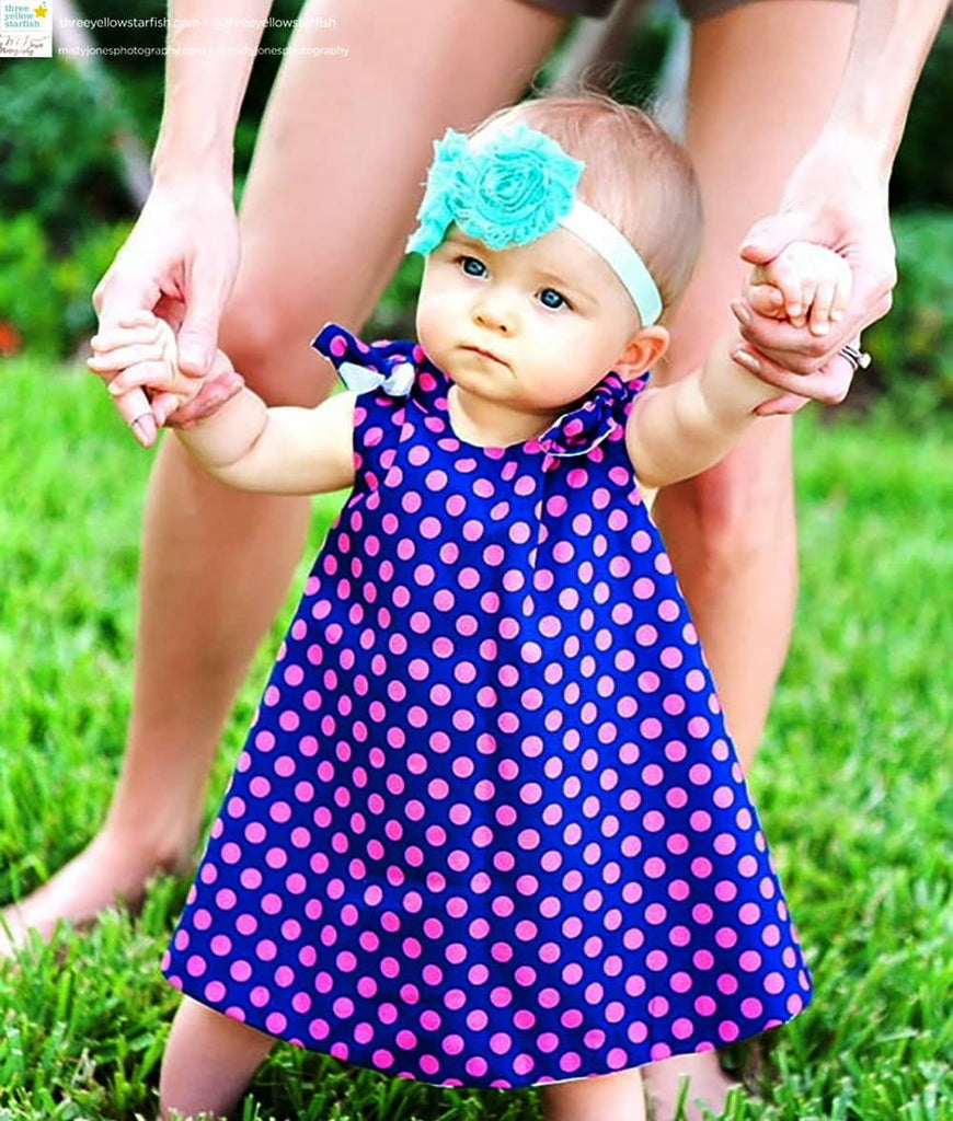 toddler wearing pinafore dress for little girls