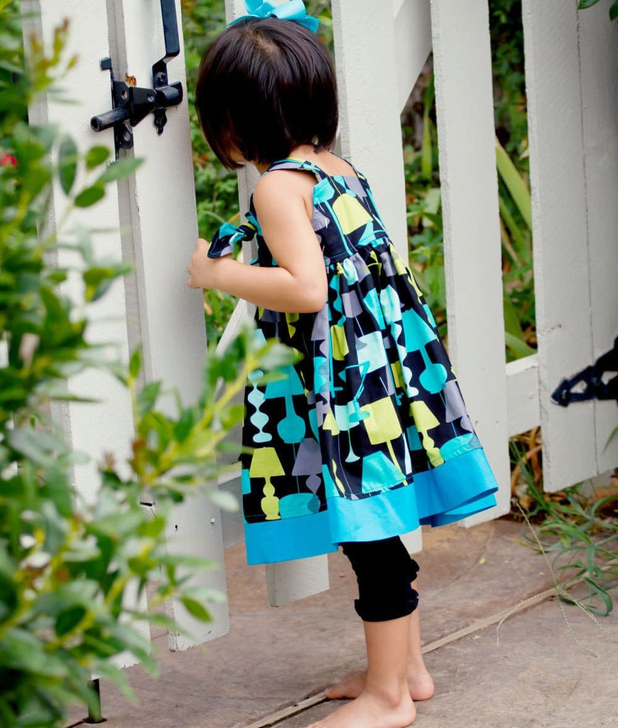 little girl wearing a royal blue toddler dress