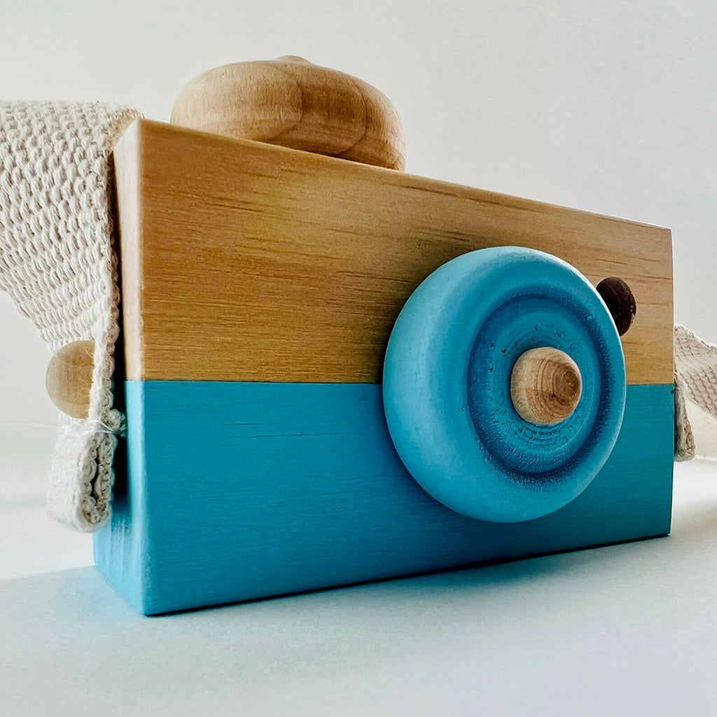 light blue wooden camera toy