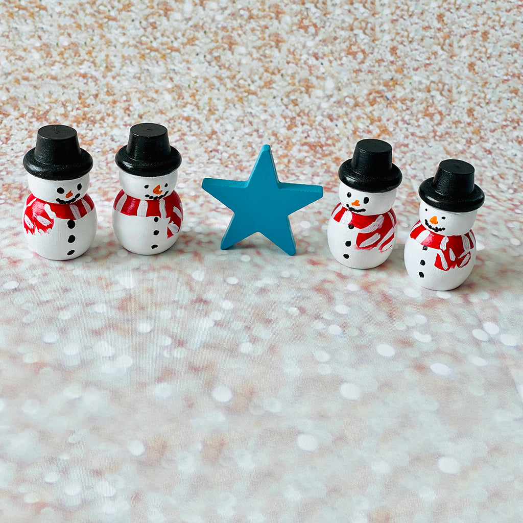 hand painted wooden Montessori snowman peg dolls and wooden blue star